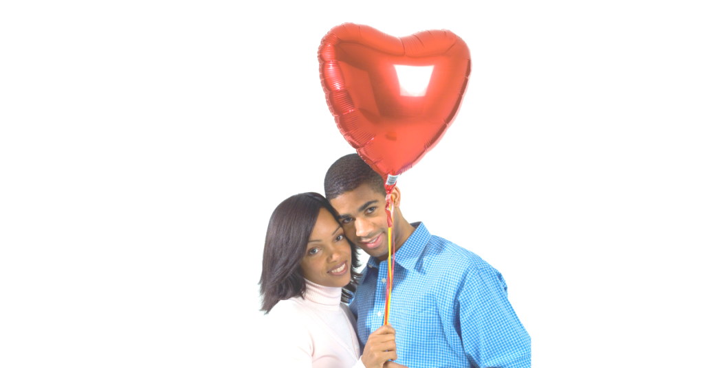 Couple holding a read helium balloon  