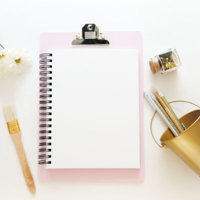 pink clip holder with notebook