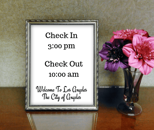 Put the guest Check in and Check Out times in a pretty little frame and place it on their desk.