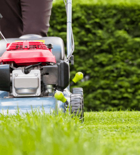 Person mowing grass as a way to earn extra money