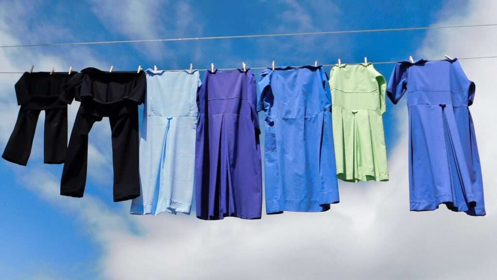 several items of clothing on a clothe line drying outside